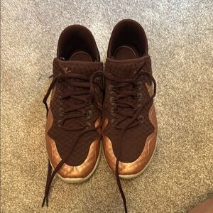 Women’s maroon Nike running shoes